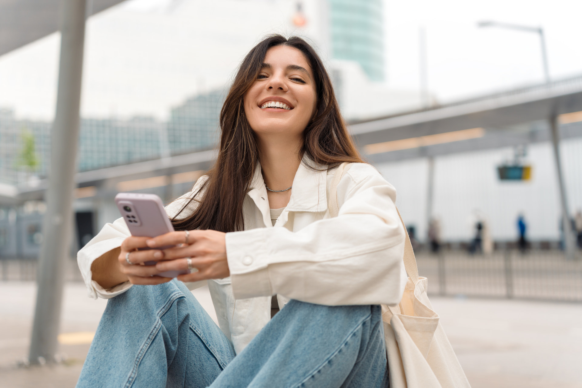 Woman checking her phone outdoors